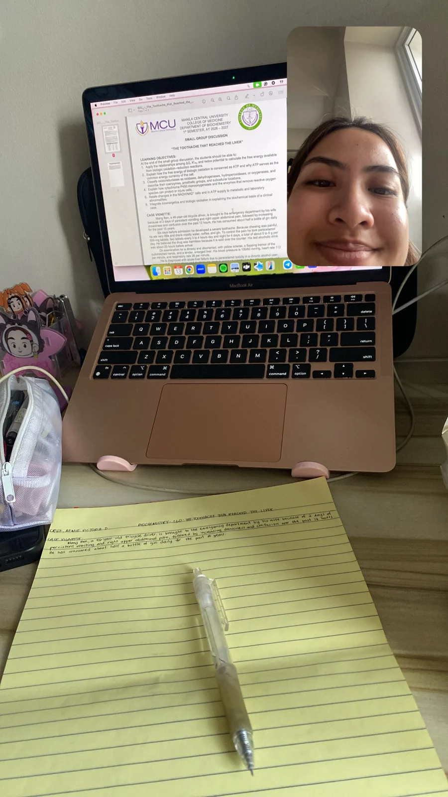 Preparing for our small-group discussion using my laptop and notes.