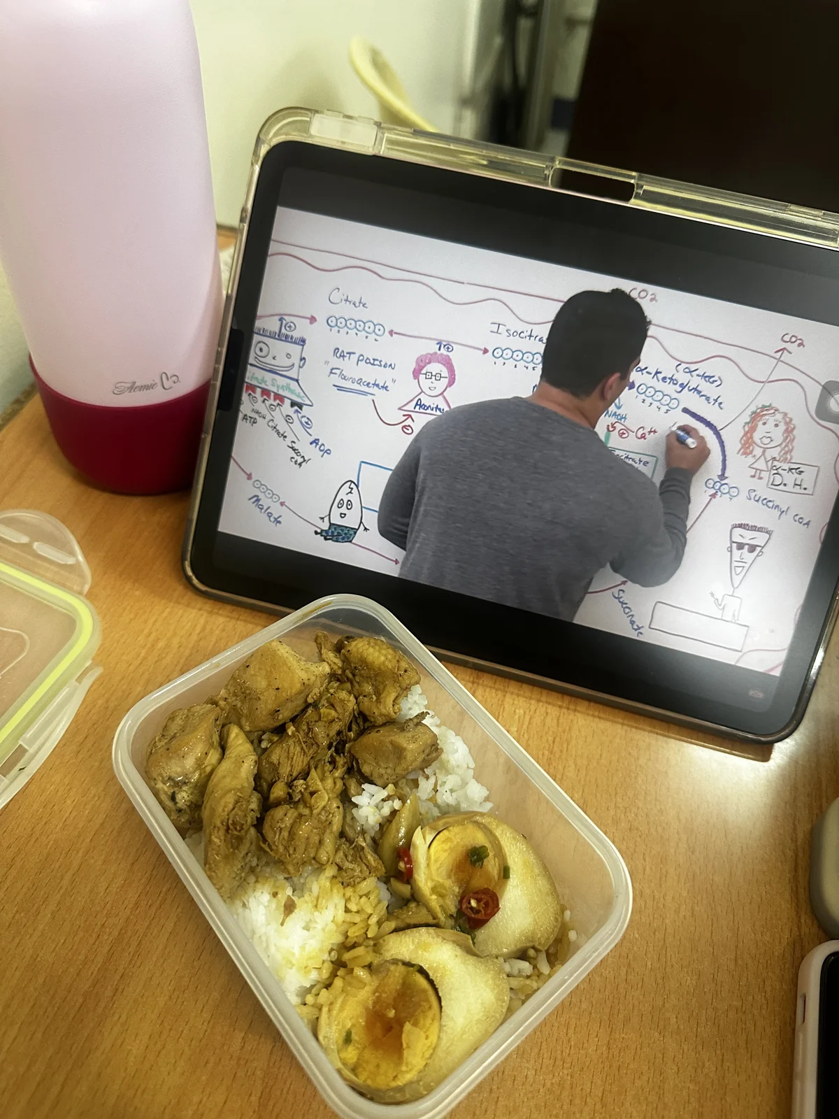 Reviewing my lessons on my tablet while having lunch.